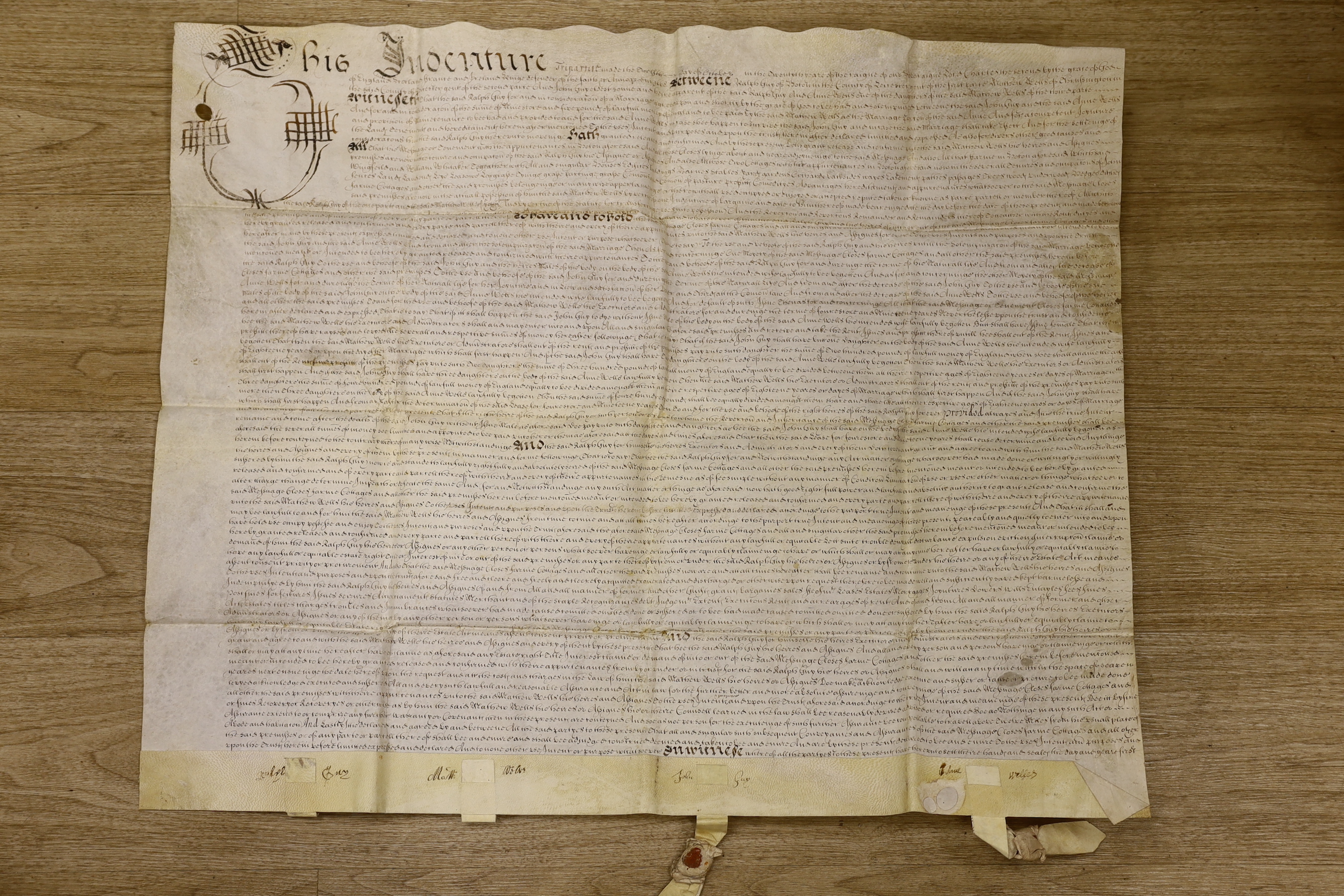 A Charles II Indenture on vellum, in English, relating to land at Hoton [a village in Leicestershire], belonging to a John Guy, dated 12th October, 1668, 62 x 78cm; together with a ‘’Genealogical Table of the ‘’Frith’’ f